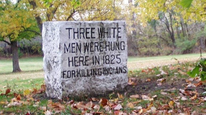 Fall Creek Massacre stone memorial fallen leaves