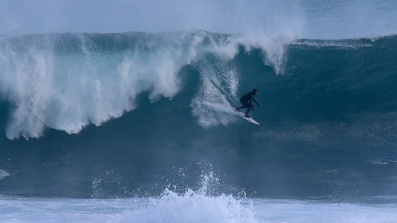 surfer rides wave at surfers point