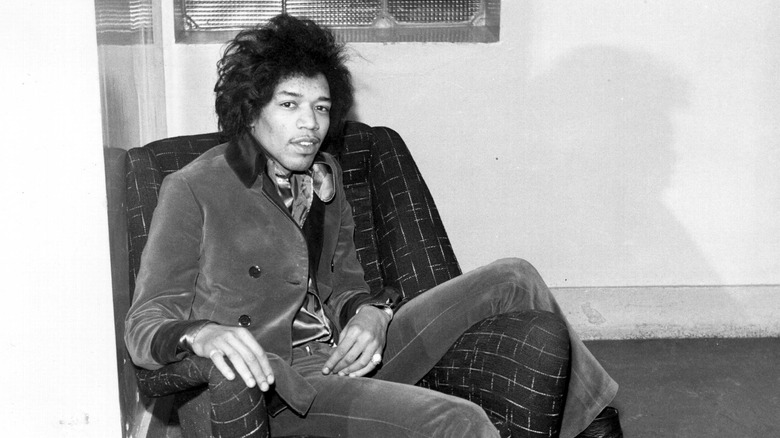 Jimi Hendrix sitting on a chair