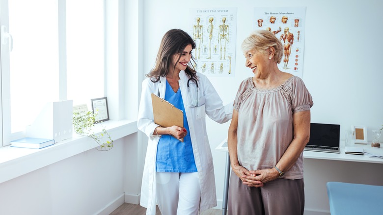 A doctor helping their patient