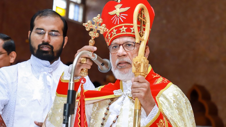 Major Archbishop George Alencherry in full regalia speaking into a microphone