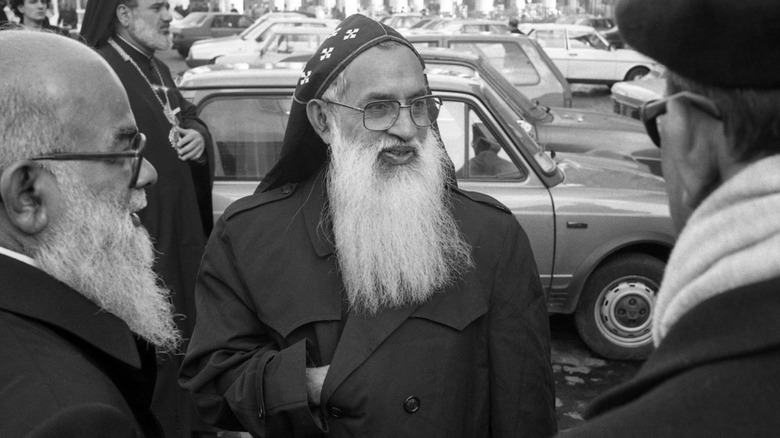 Former Syro-Malankara Major Archbishop Benedict Gregoris in front of an old car