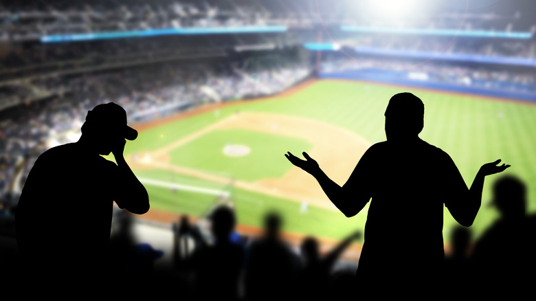 Angry fans silhouette at baseball stadium