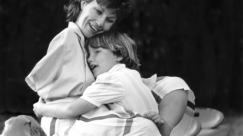 British Thalidomide victim hugging son