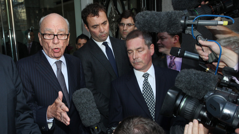 Rupert Murdoch is questioned by reporters
