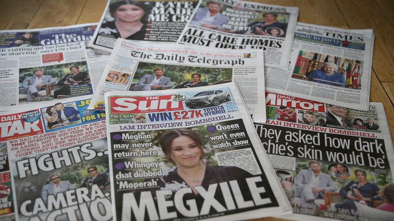 tabloids with Meghan Markle on cover