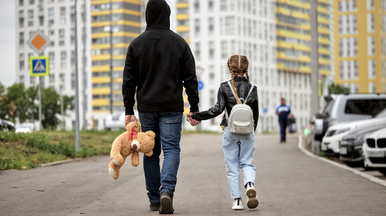 Girl walking with man