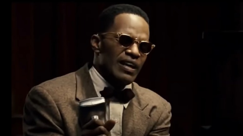 Jamie Foxx portraying Ray Charles