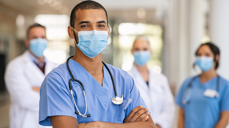 A group of doctors standing proud