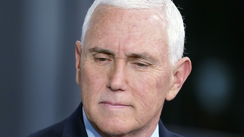 Mike Pence frowns looks down