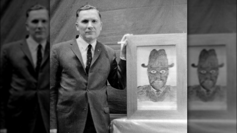 Albert K. Bender with sketch of man in black