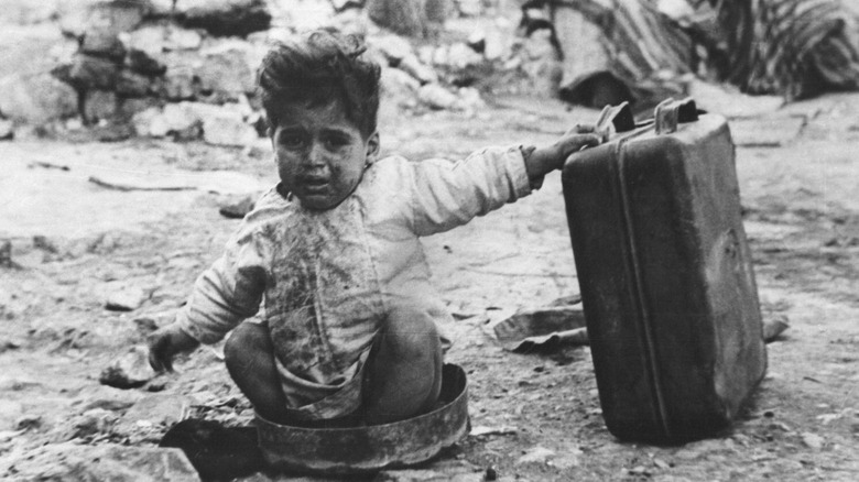 Palestinian child crying in squalor