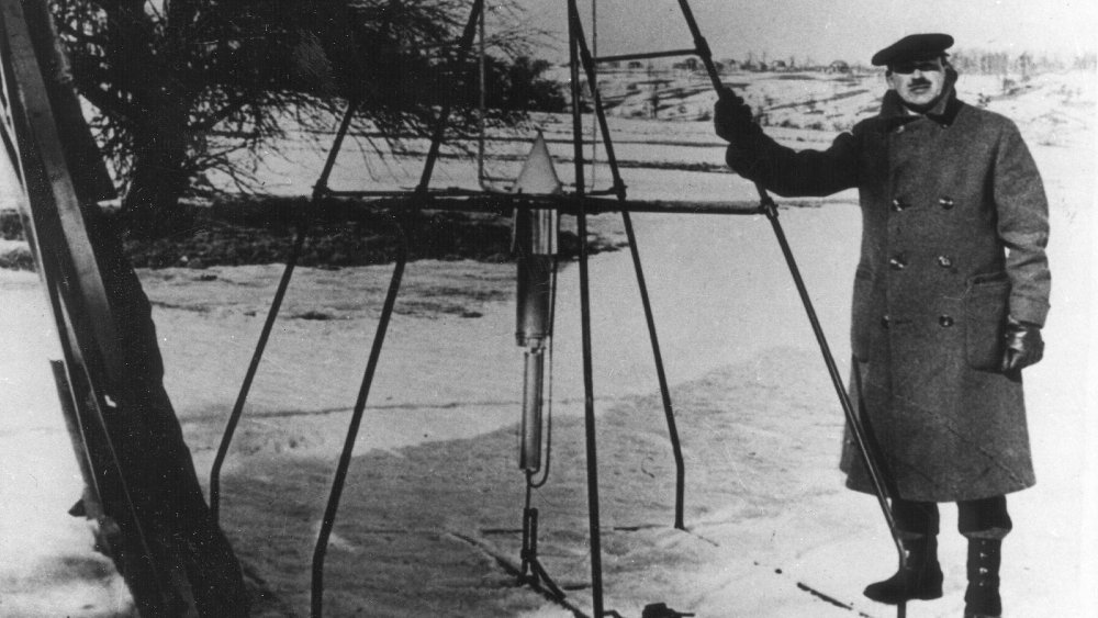 Robert Goddard and his first successful liquid-fueled rocket.
