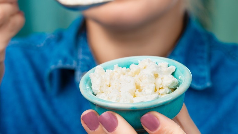 Woman eating cottage cheese