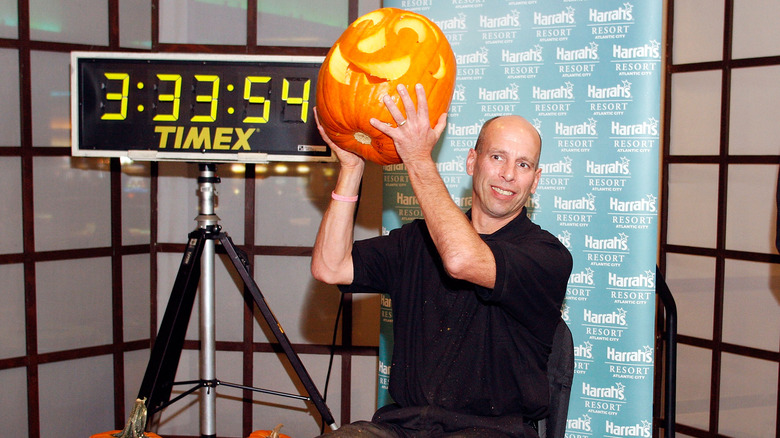 Stephen Clarke holding carved pumpkin