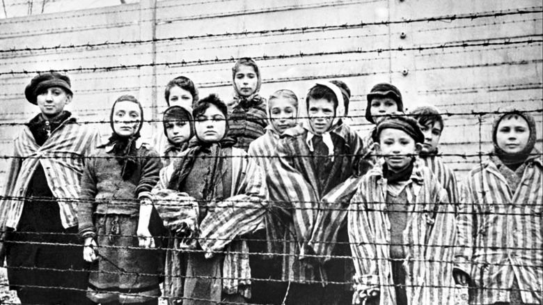 Jewish children behind barbed wire fence