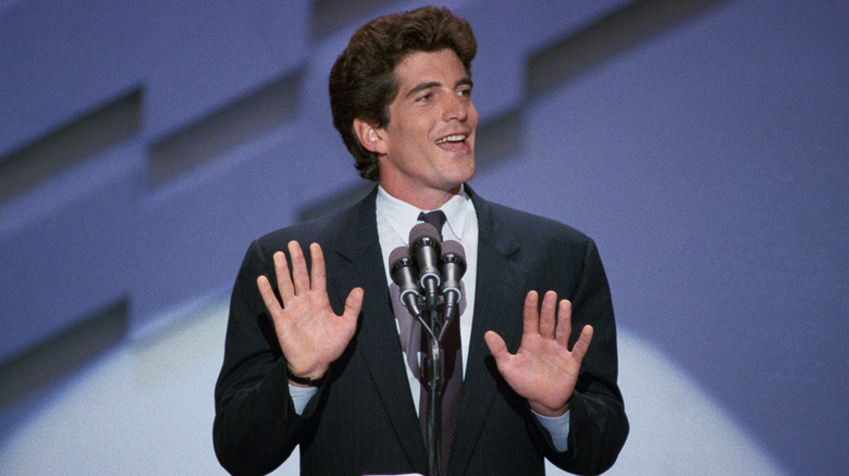 JFK Jr smiles and speaks