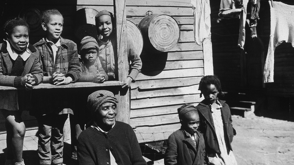 Elderly woman and her grandchildren