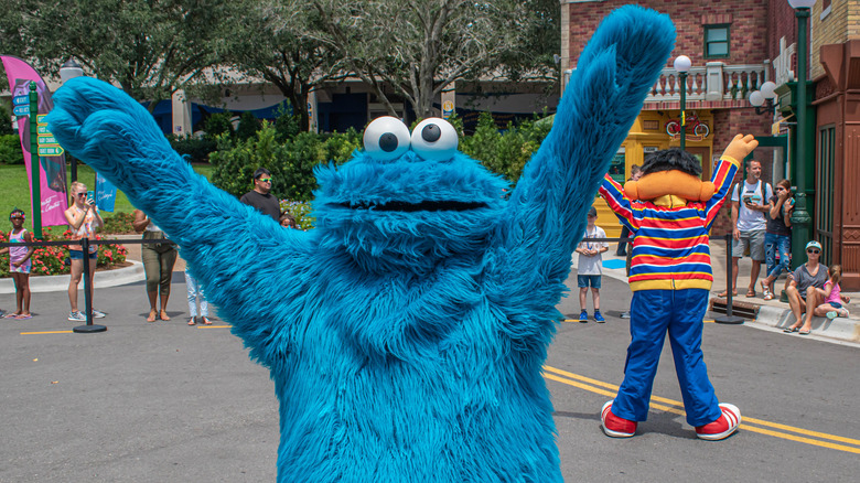 Cookie Monster, arms outstretched