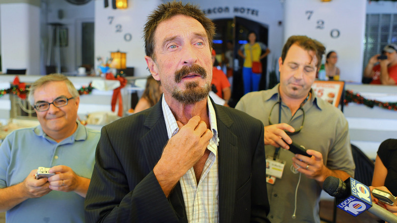 John McAfee talks to reporters