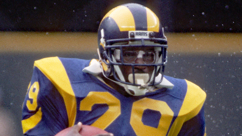 Eric Dickerson Rams helmet holding football