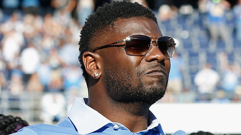 LaDanian Tomlinson looking up sunglasses