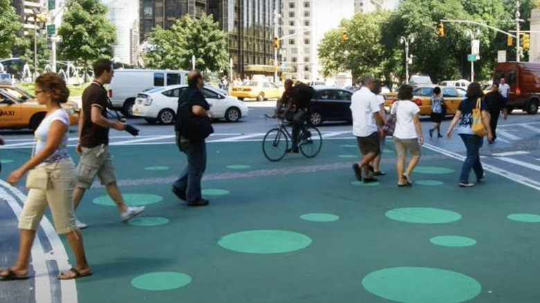 Sidewalk with green streetbond paint.