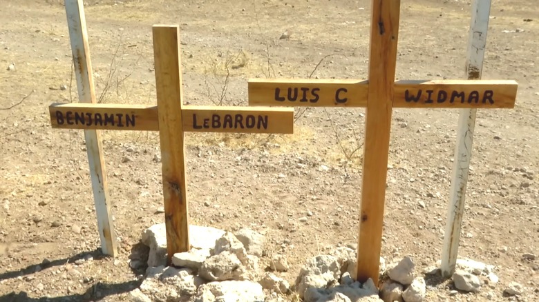 Wooden cross memorial on roadside