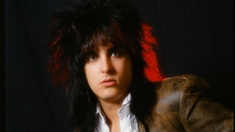 Nikki Sixx brown suit straightened hair