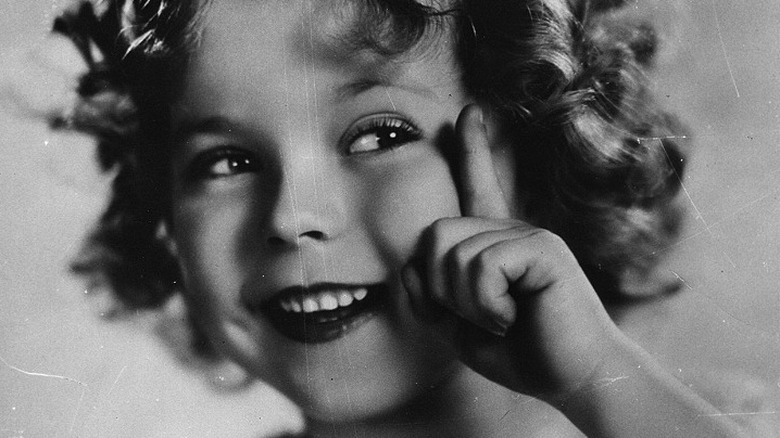 Shirley Temple: dimples, curly hair, smile