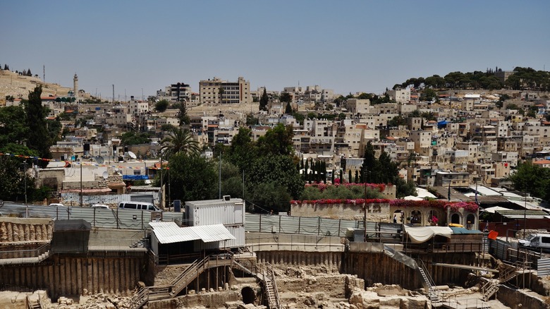 View of buildings in East Jerusalem against a blue sky background