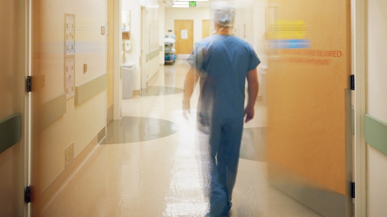 Doctor walking in hospital hallway