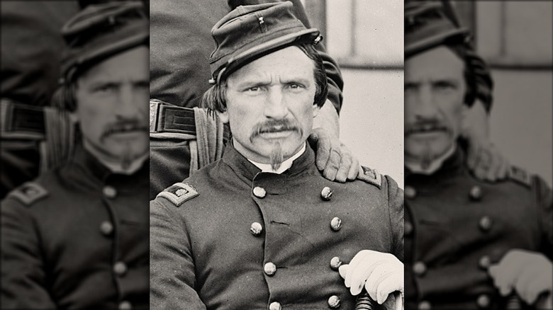 Henry Sawyer sitting in uniform with a hand on his shoulder during the Civil War