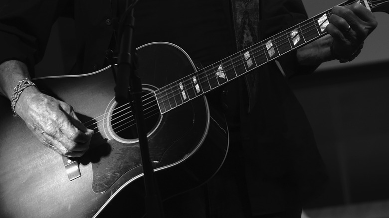 Kris Kristofferson playing guitar