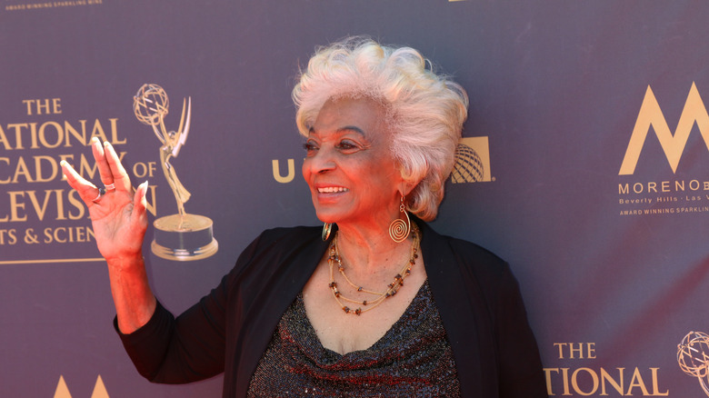 Nichelle Nichols with hand up