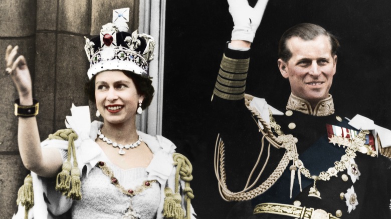 Queen Elizabeth and Prince Philip waving on Coronation Day