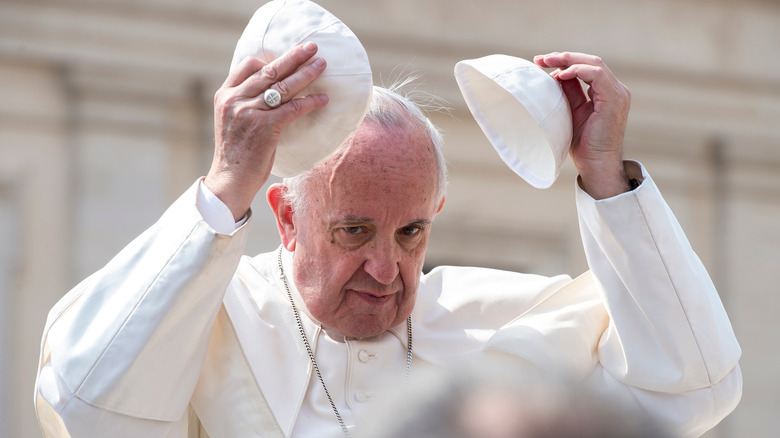 Pope Francis changing zuchetto