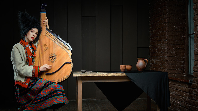 woman holding a bandura