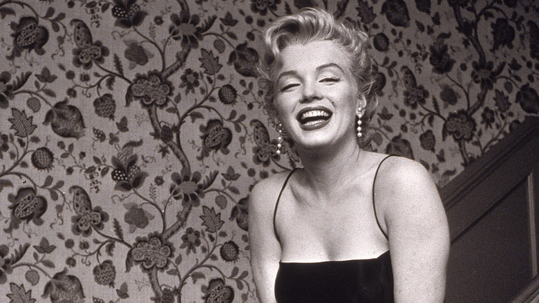 Marilyn Monroe and flowered wallpaper