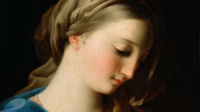 Mary bows her head