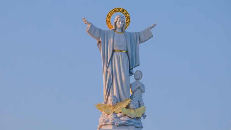 Statue of Mary against sky