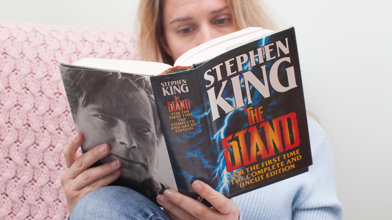 Woman redading Stephen King's The Stand