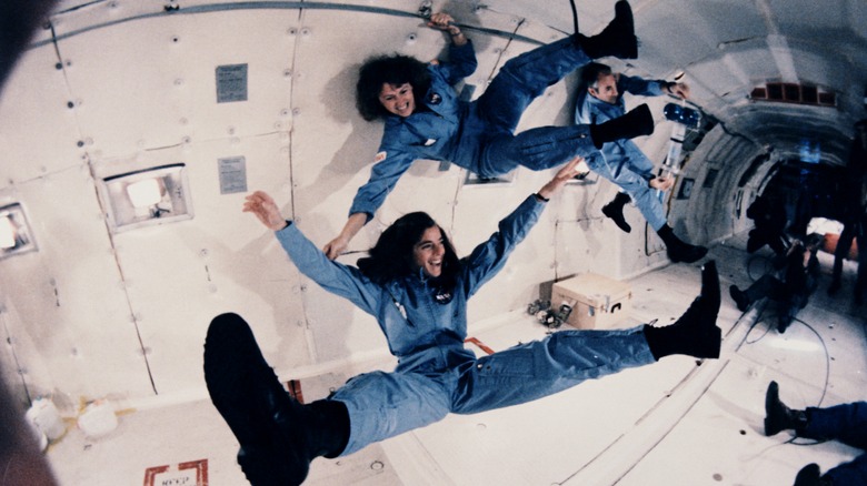 mcauliffe and morgan smiling in zero g plane