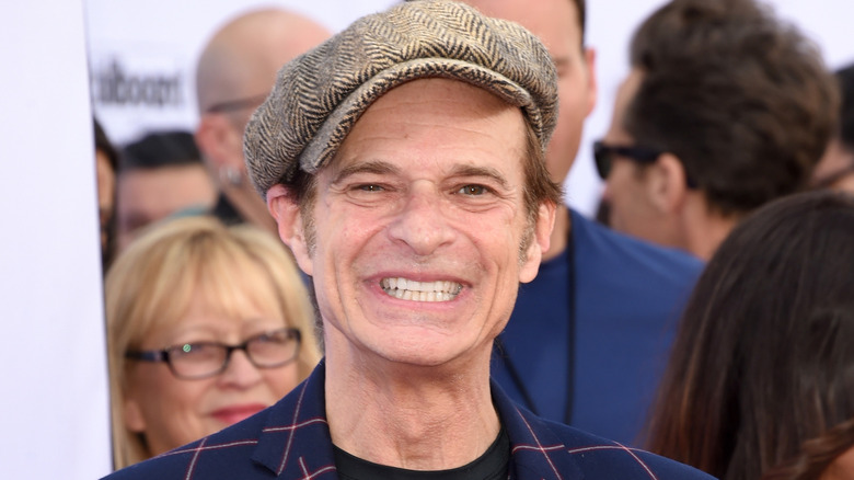 david lee roth smiling in flat cap