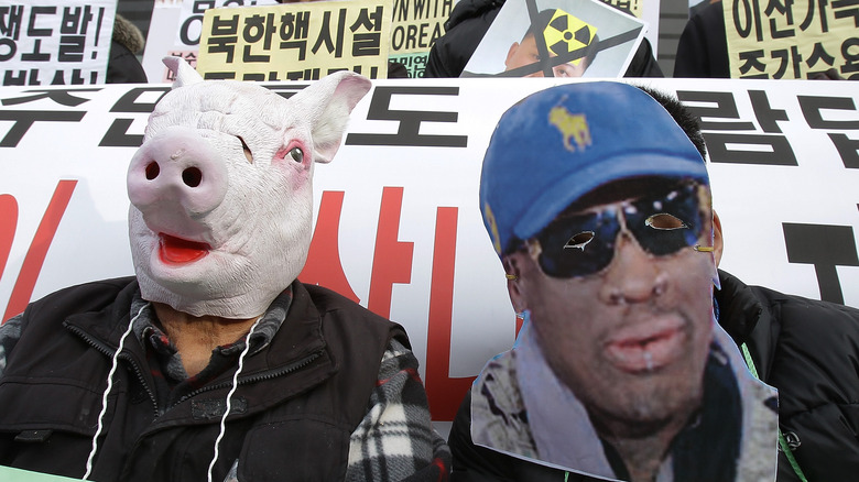 South Korean protestor Dennis Rodman mask at protest