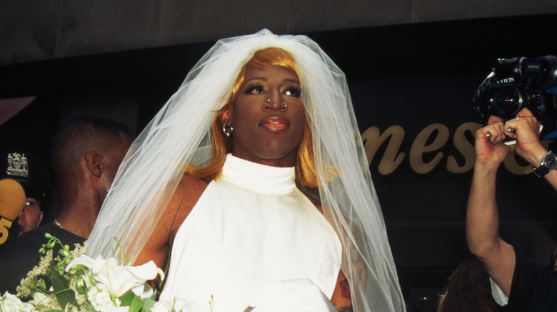 Dennis Rodman wedding gown golden wig at event