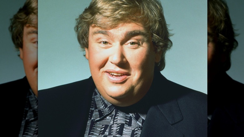 john candy half smiling raised eyebrows