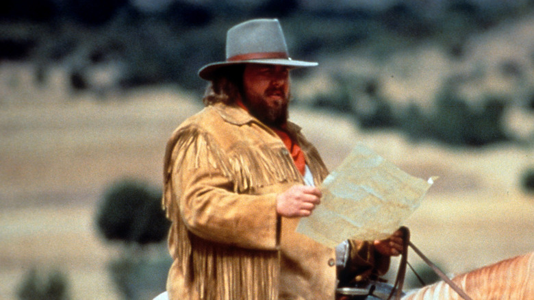 john candy horseback in still from wagons east