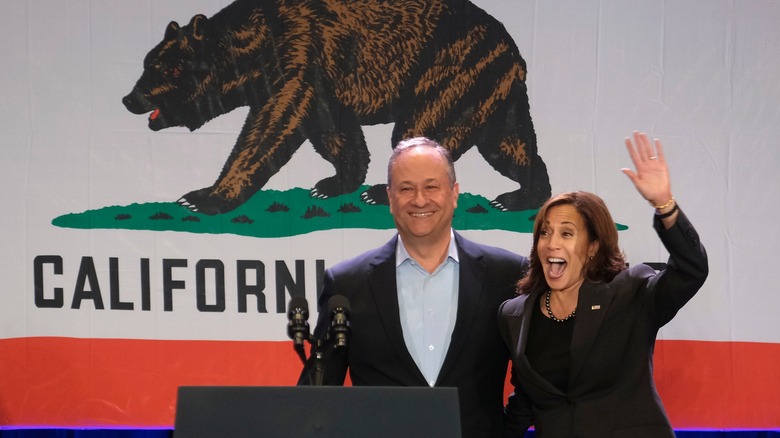 Harris, husband wave before California flag