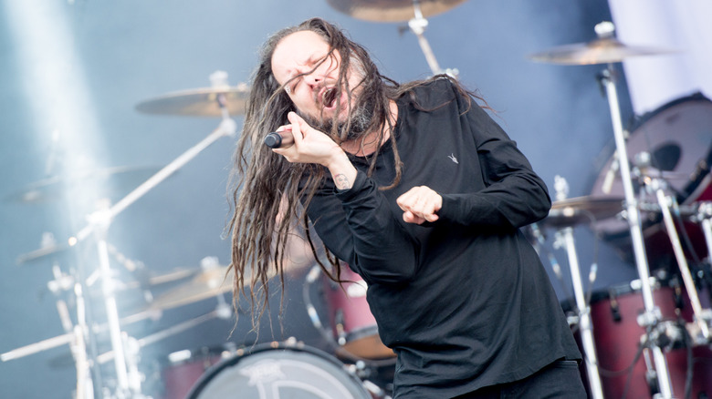 Korn's Jonathan Davis singing live on stage at Download Festival 2018